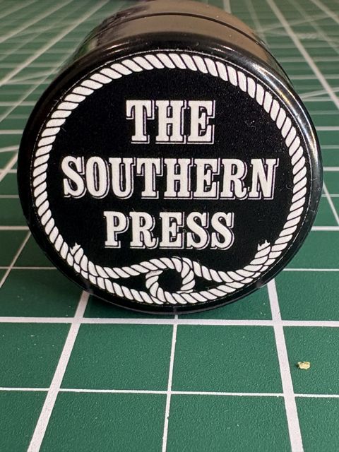 The Southern Press lid: the brand name in a rope border