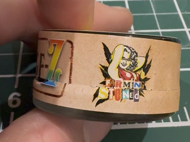 The other side of the label: the Farming Stoned logo, the farm that grew the flower