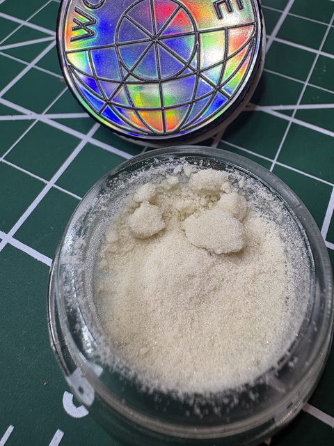 The open jar from another angle, with the lid behind it